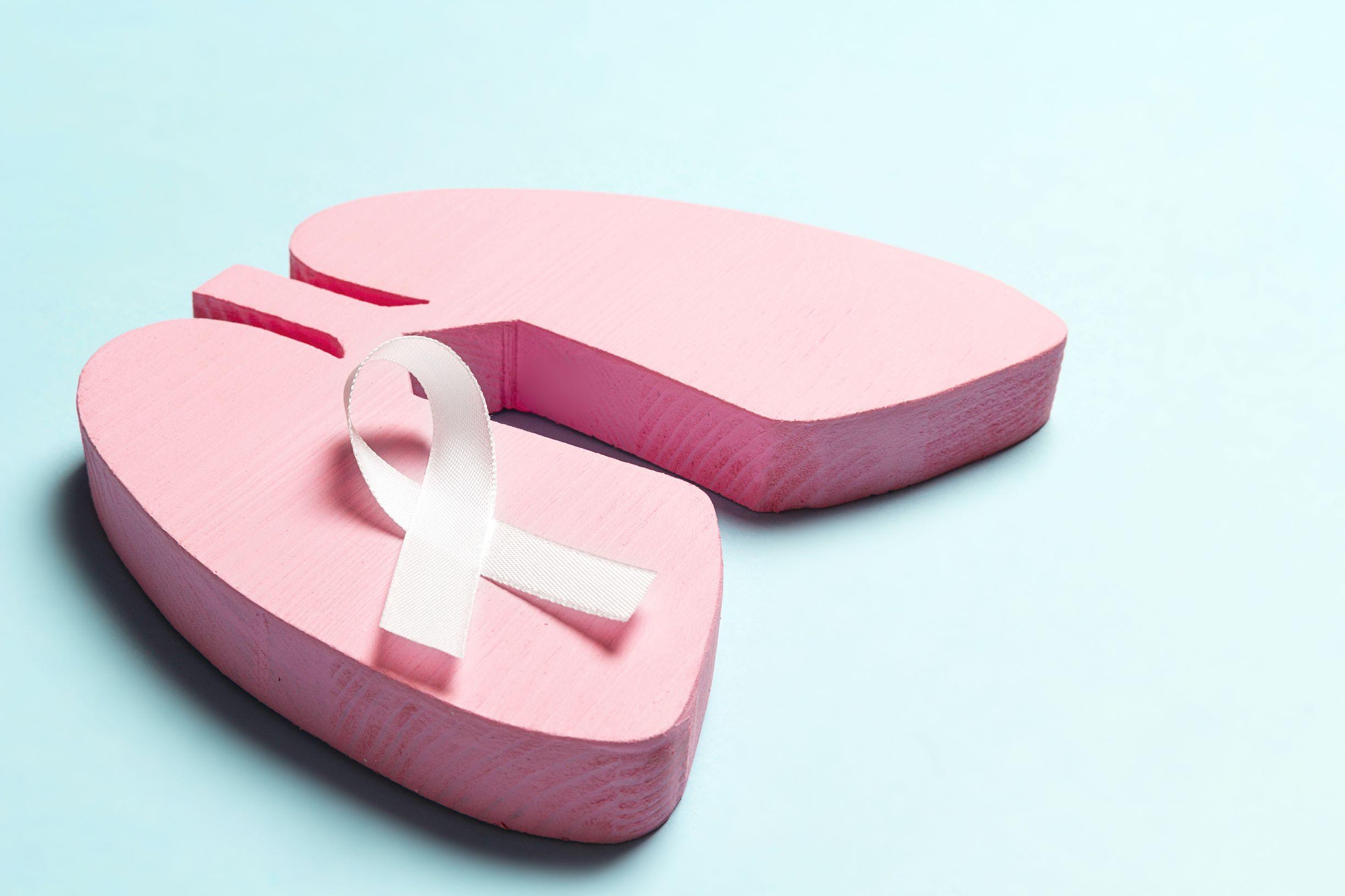 Graphic image of pink lungs with white ribbon