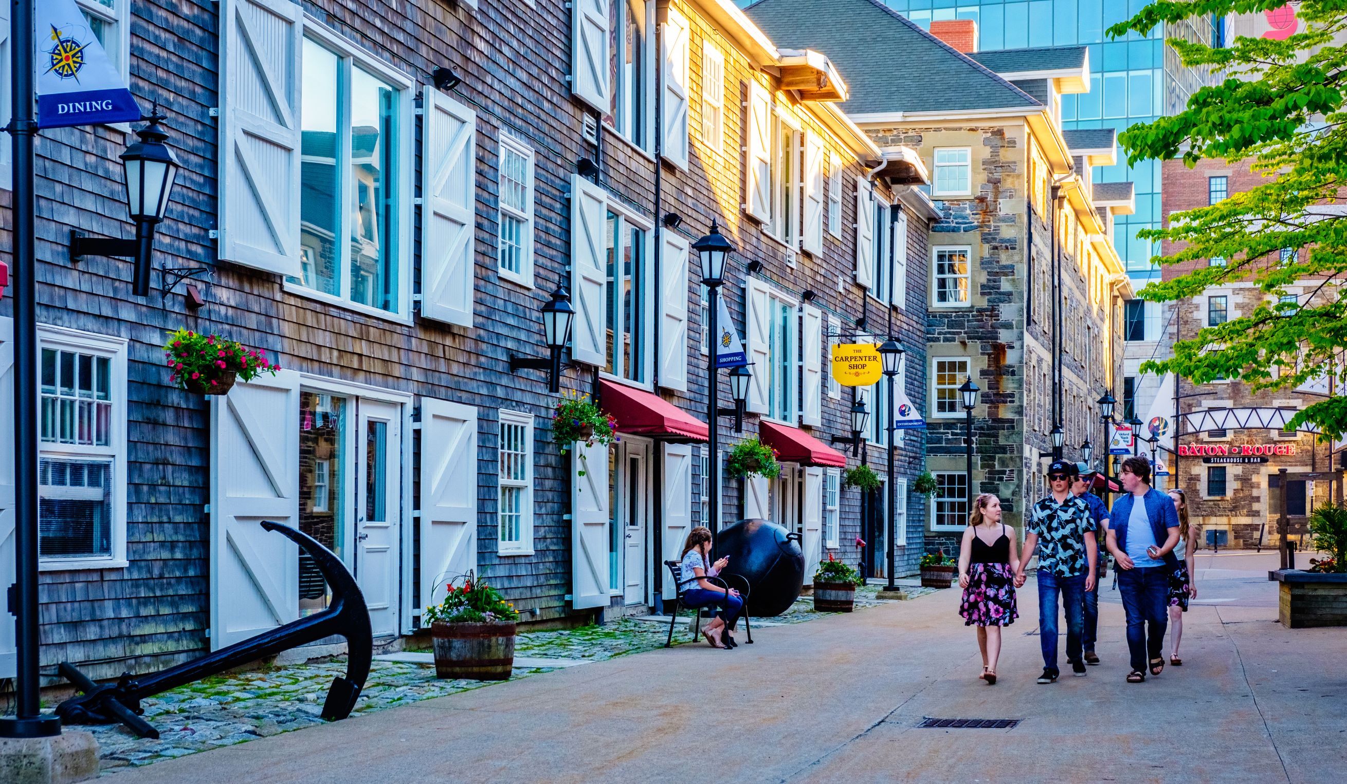 People walking down historic Halifax street.