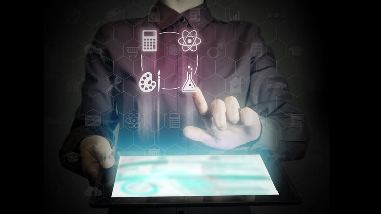 Person holding a tablet, above which are floating graphic images of a calculator and art and science symbols.