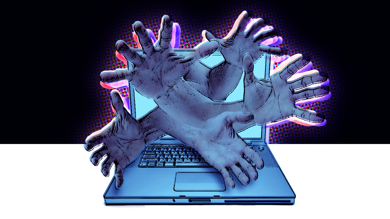 Hands coming out of a computer.