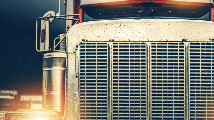 Close-up of truck with lights on.