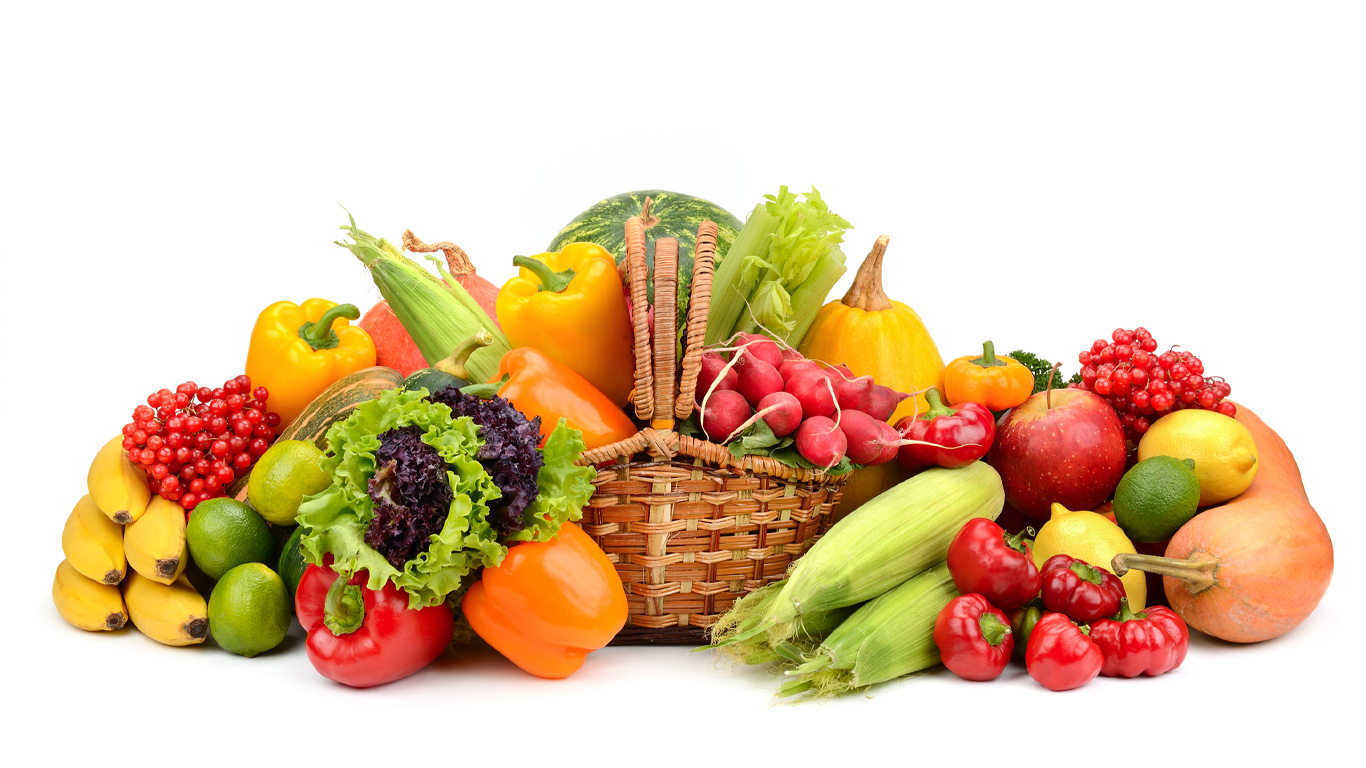 Pile of garden vegetables overflowing from basket