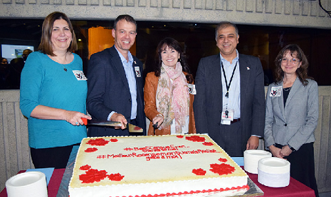 From left to right: Jane Badets, Marc Hamel, Connie Graziadei, Anil Arora and Gabrielle Beaudoin cut the cake at an event celebrating the final release of the 2016 Census.