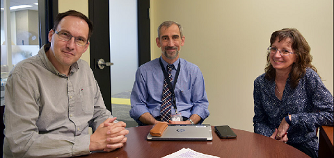 From left to right: Fabrice Mosseray, Richard Evans and Gabrielle Beaudoin prepare to film a bi-weekly episode of the Review of Economic Statistics.