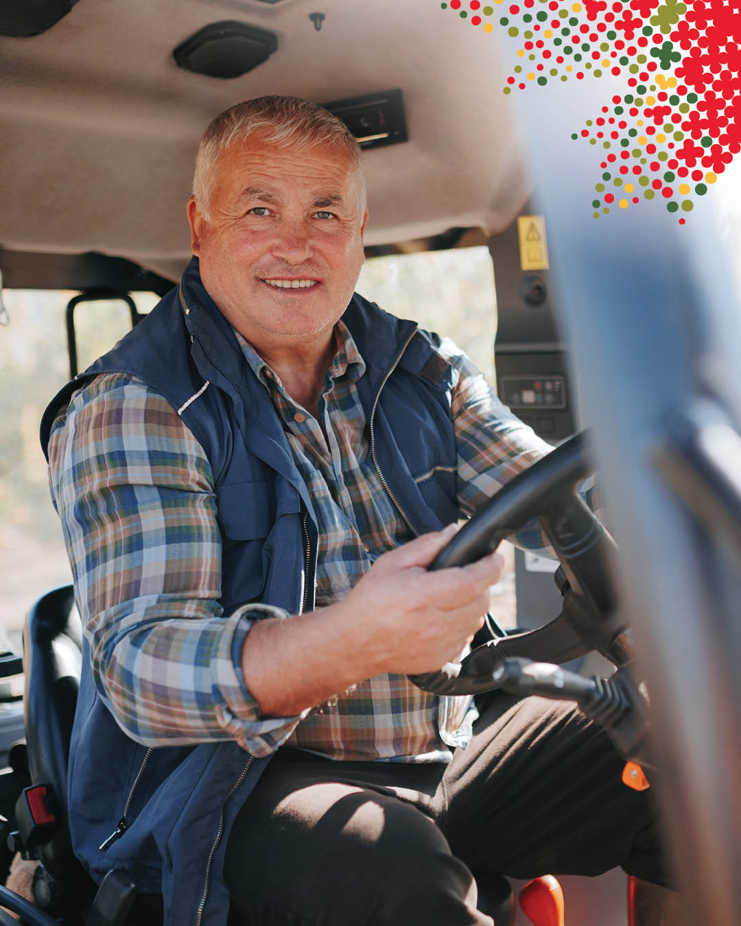 Photo of a person driving a tractor.
